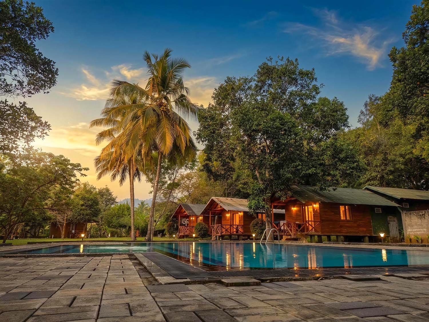 Mastodon Valley Safari Resort Pool and Cottages at Sunset